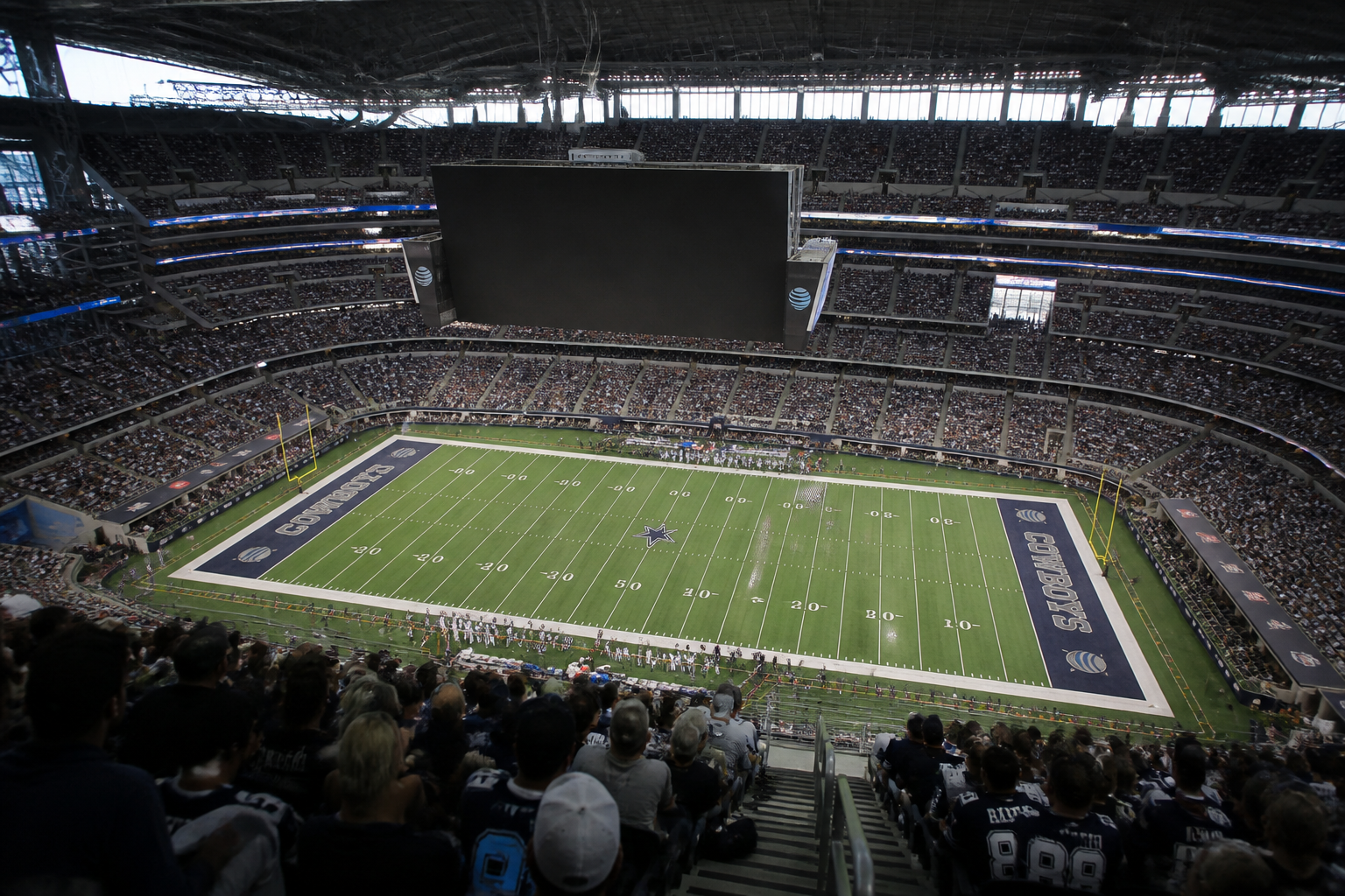 Spectators fill the stands of AT&T Stadium, home of the Dallas Cowboys, the NFL franchise valued at a record $12.5 billion.